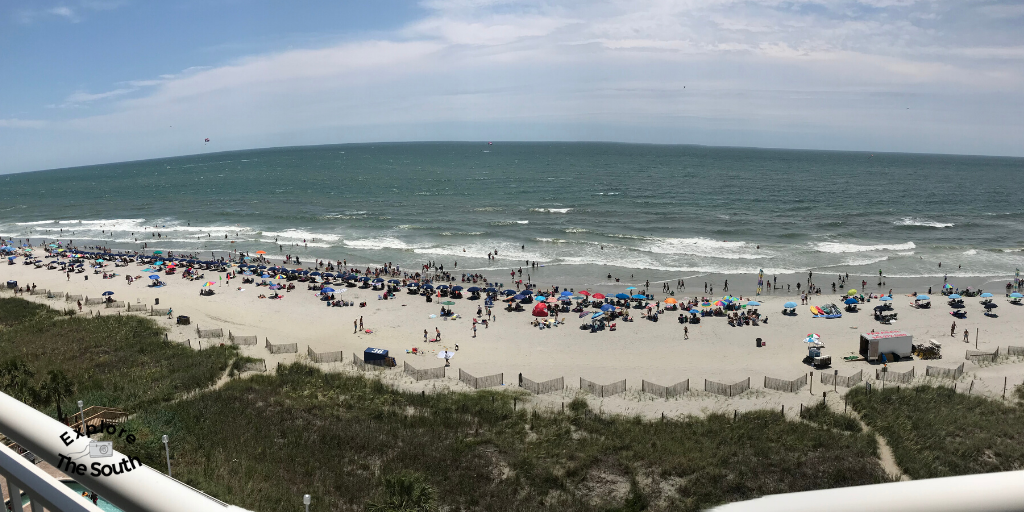 A panoramic view of the ocean from a balcony